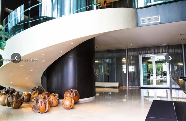 a view of a living room and dining room