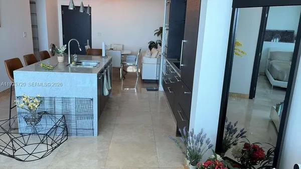 a hallway with a view of living room