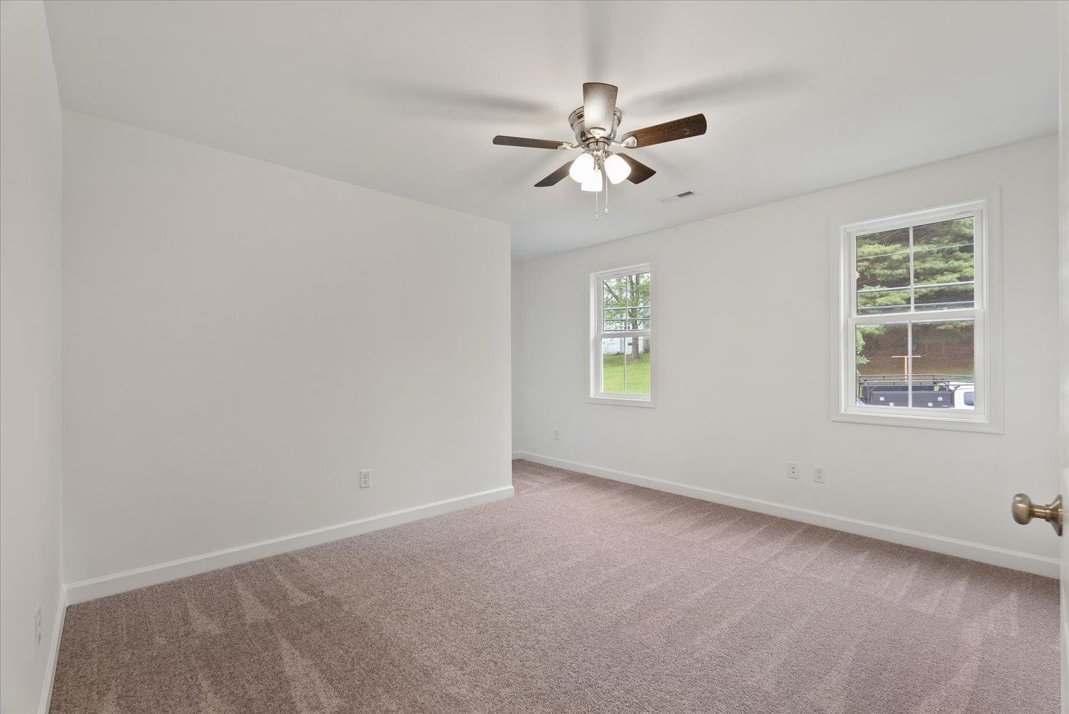 Lot 8 Middlebrook Avenue Staunton, VA 24401 - Photo 21 of 39 an empty room with windows and fan