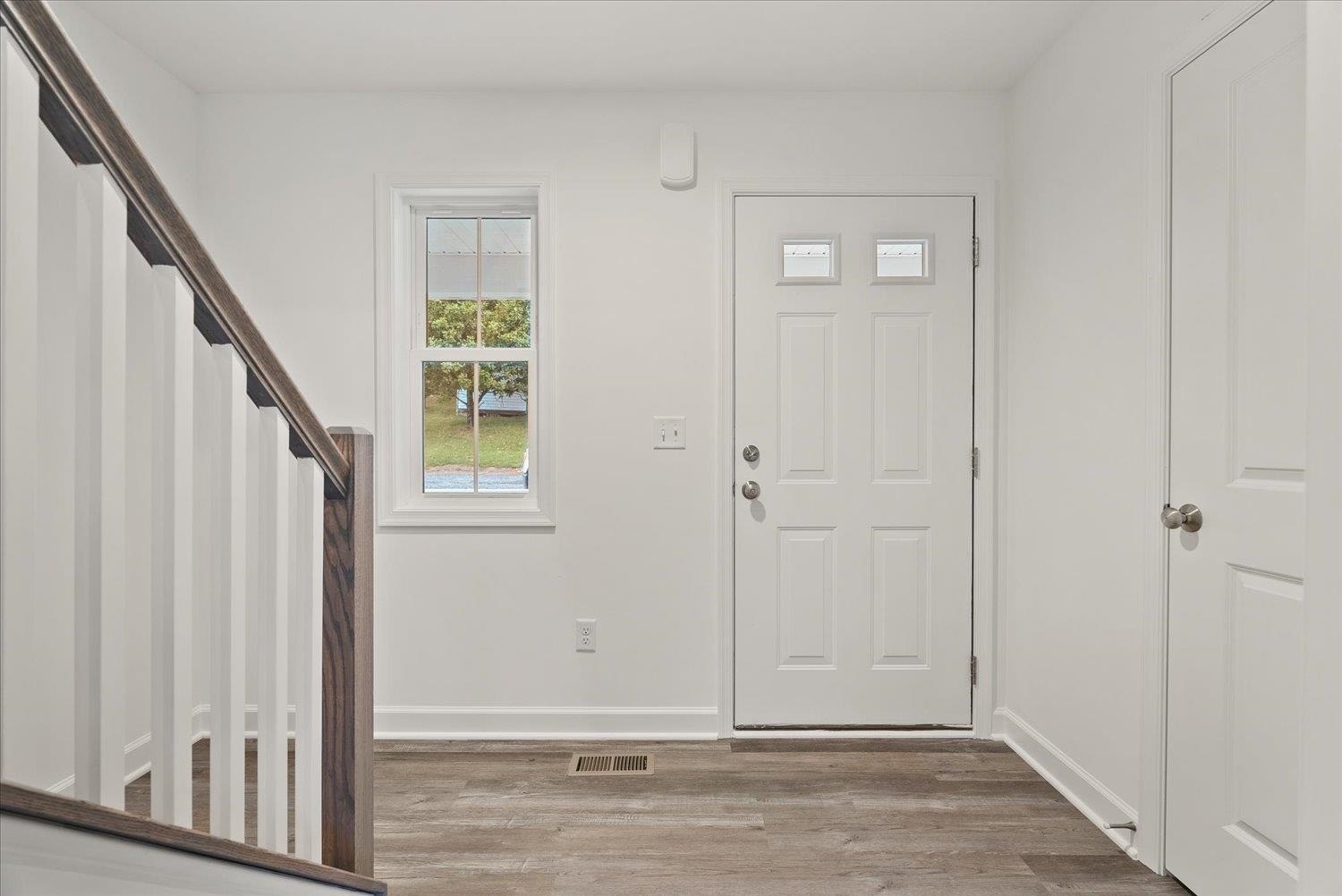 Lot 8 Middlebrook Avenue Staunton, VA 24401 - Photo 6 of 39 an empty room with wooden floor and windows