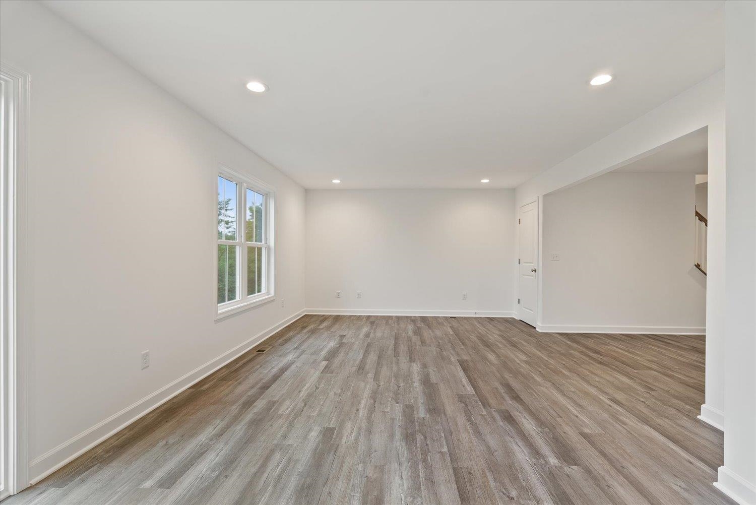 Lot 8 Middlebrook Avenue Staunton, VA 24401 - Photo 8 of 39 an empty room with wooden floor and windows
