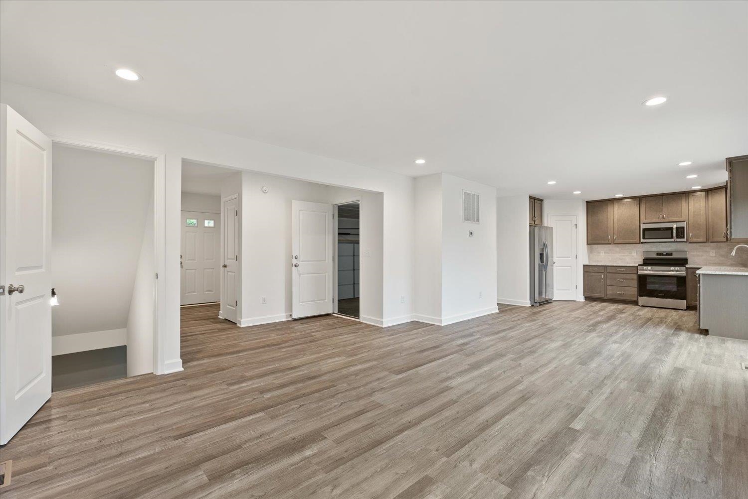 Lot 8 Middlebrook Avenue Staunton, VA 24401 - Photo 9 of 39 a view of a kitchen with wooden floor and a refrigerator