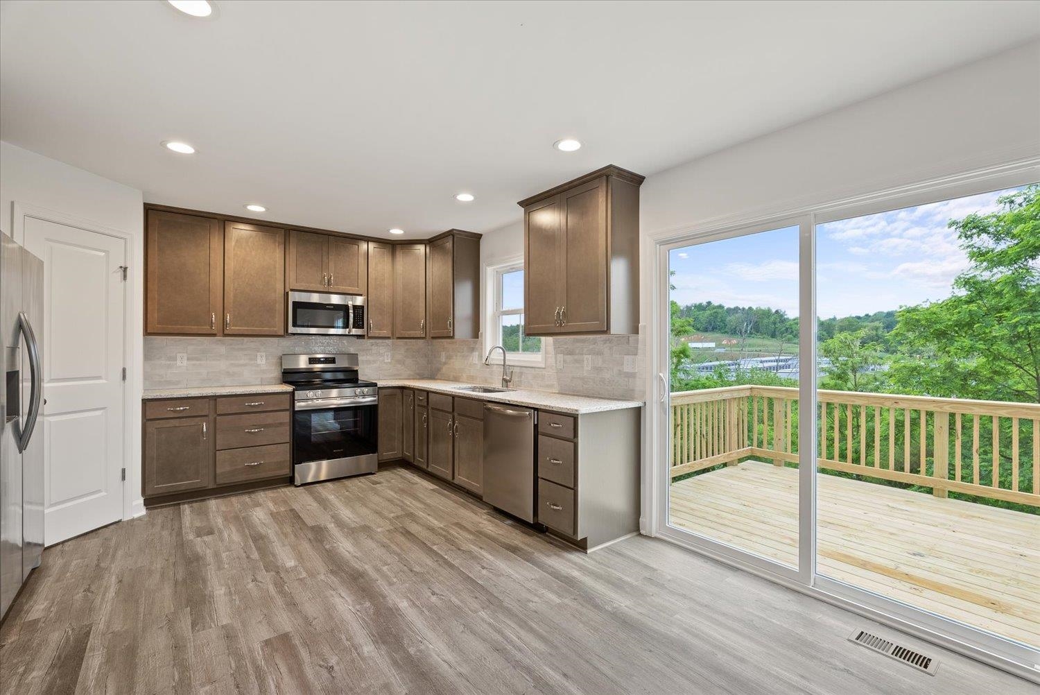 Lot 8 Middlebrook Avenue Staunton, VA 24401 - Photo 10 of 39 a kitchen with a refrigerator sink and cabinets