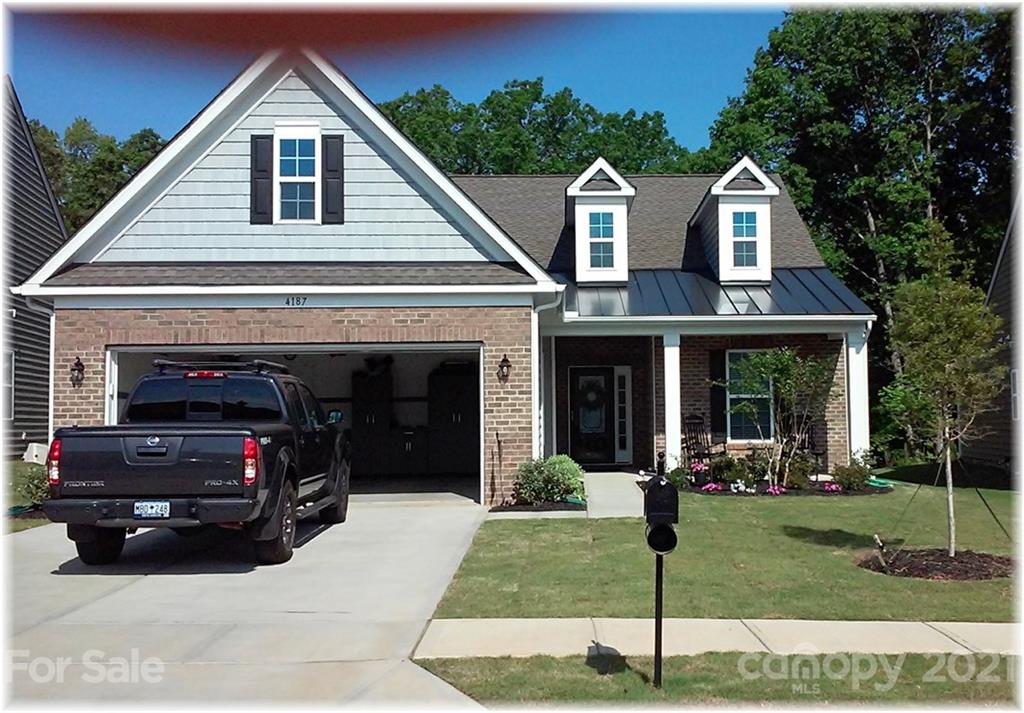 4187 Perth Road Indian Land, SC 29707 - Photo 1 of 1 a view of a house with a yard and potted plants