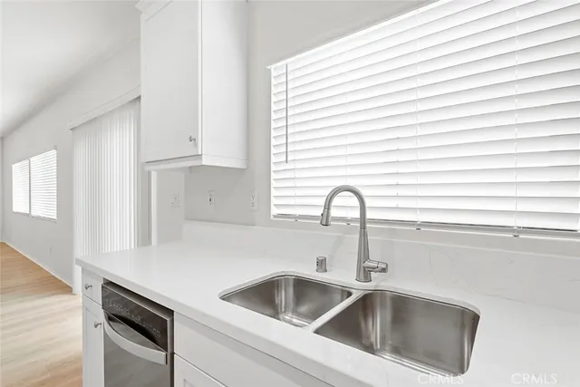a view with a sink and cabinets