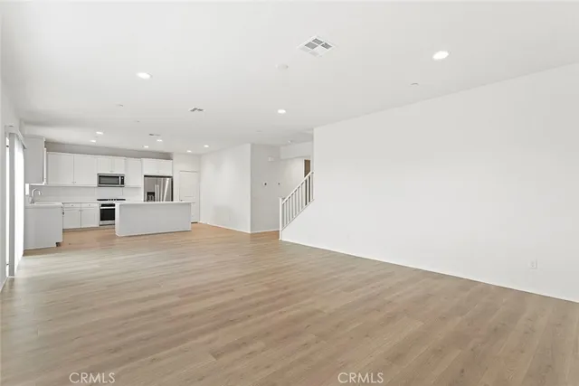 a view of kitchen with wooden floor