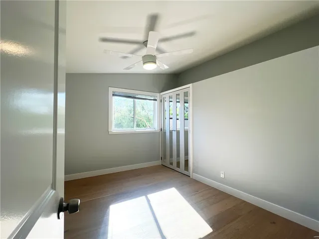 a view of an empty room and a window