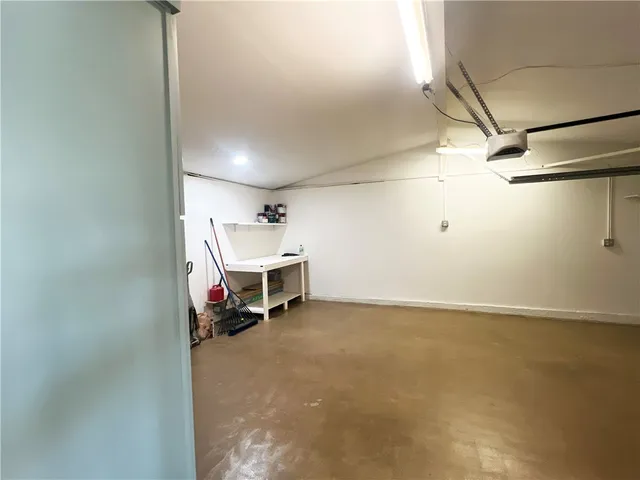 a view of a house with a yard and garage