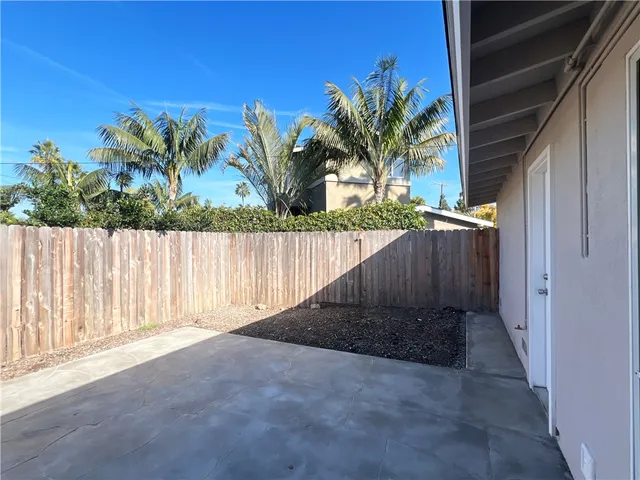 a white wall with black white and white cabinet
