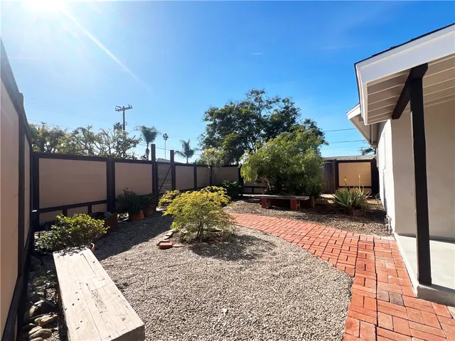 a view of a backyard with sitting area