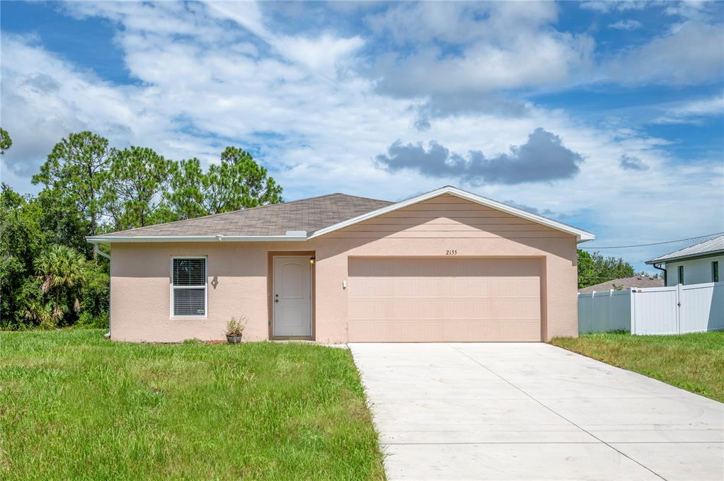 2155 Halblum Street North Port, FL 34288 - Photo 1 of 1 a front view of a house with garden