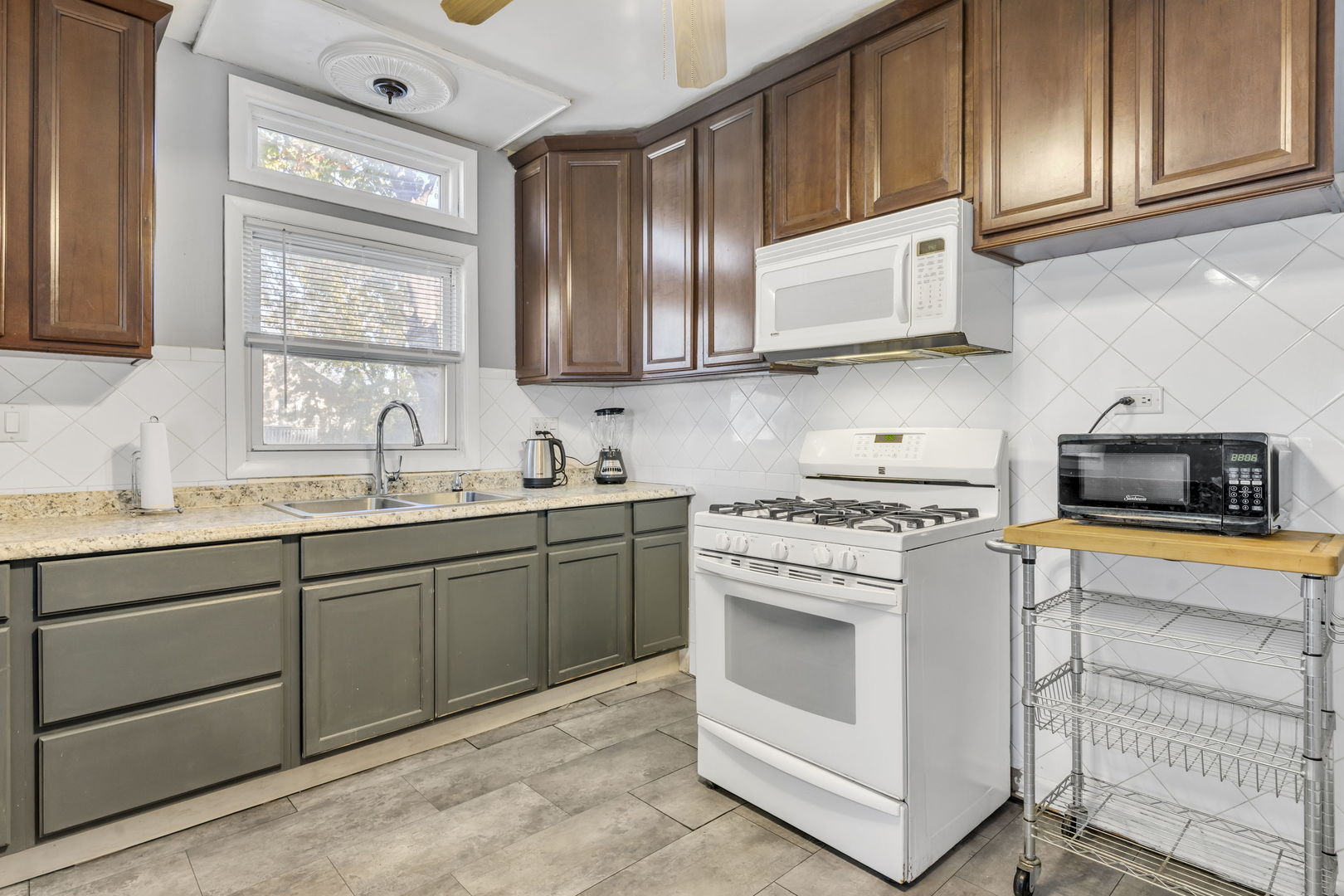 5402 South 73rd Avenue Summit, IL 60501 - Photo 9 of 17 a kitchen with stainless steel appliances granite countertop a stove and a sink