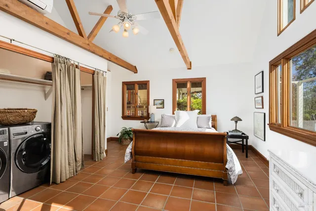 a bedroom with furniture and a window