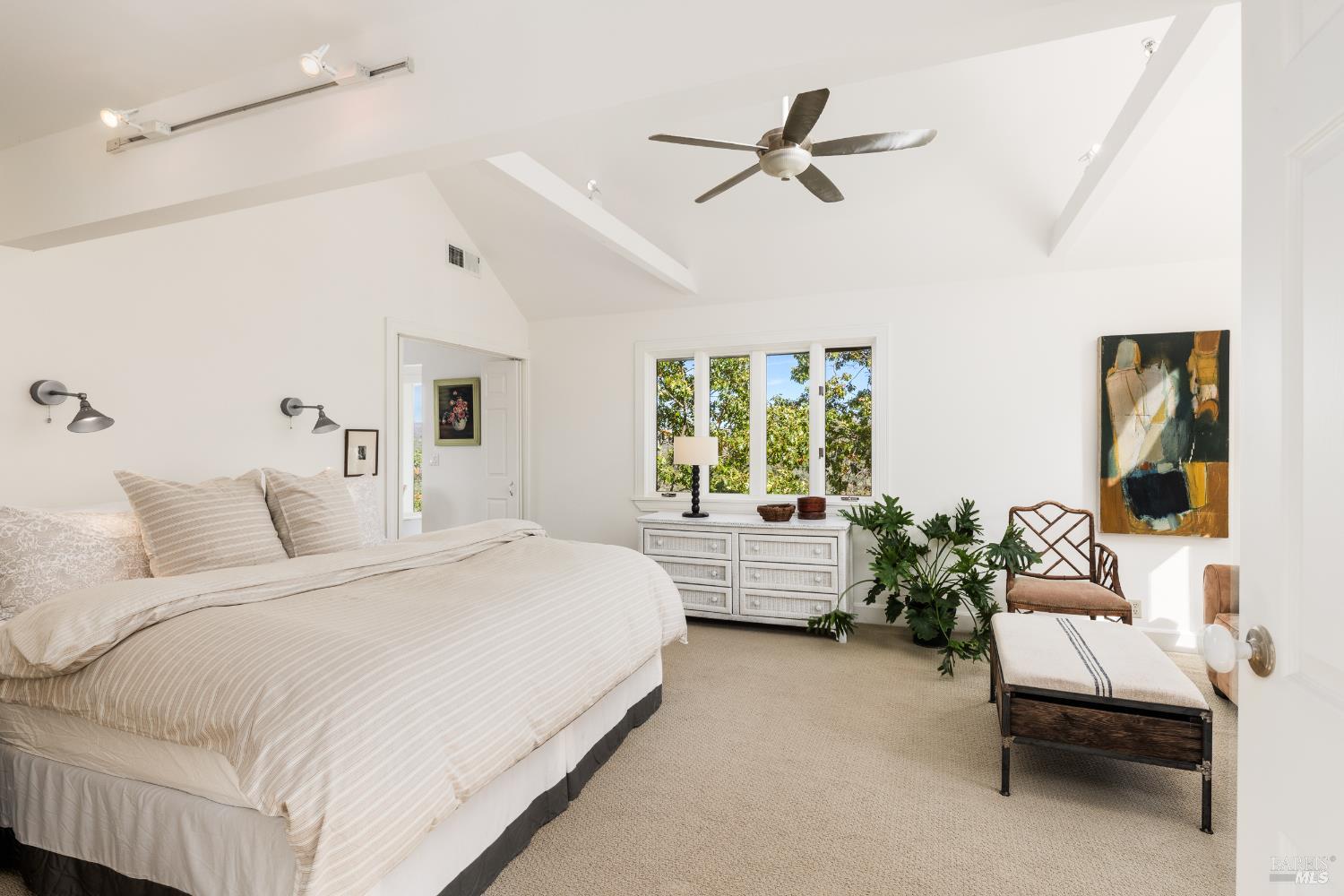 1760 Howell Mountain Road Angwin, CA 94508 - Photo 25 of 31 a bed room with a bed and a chandelier