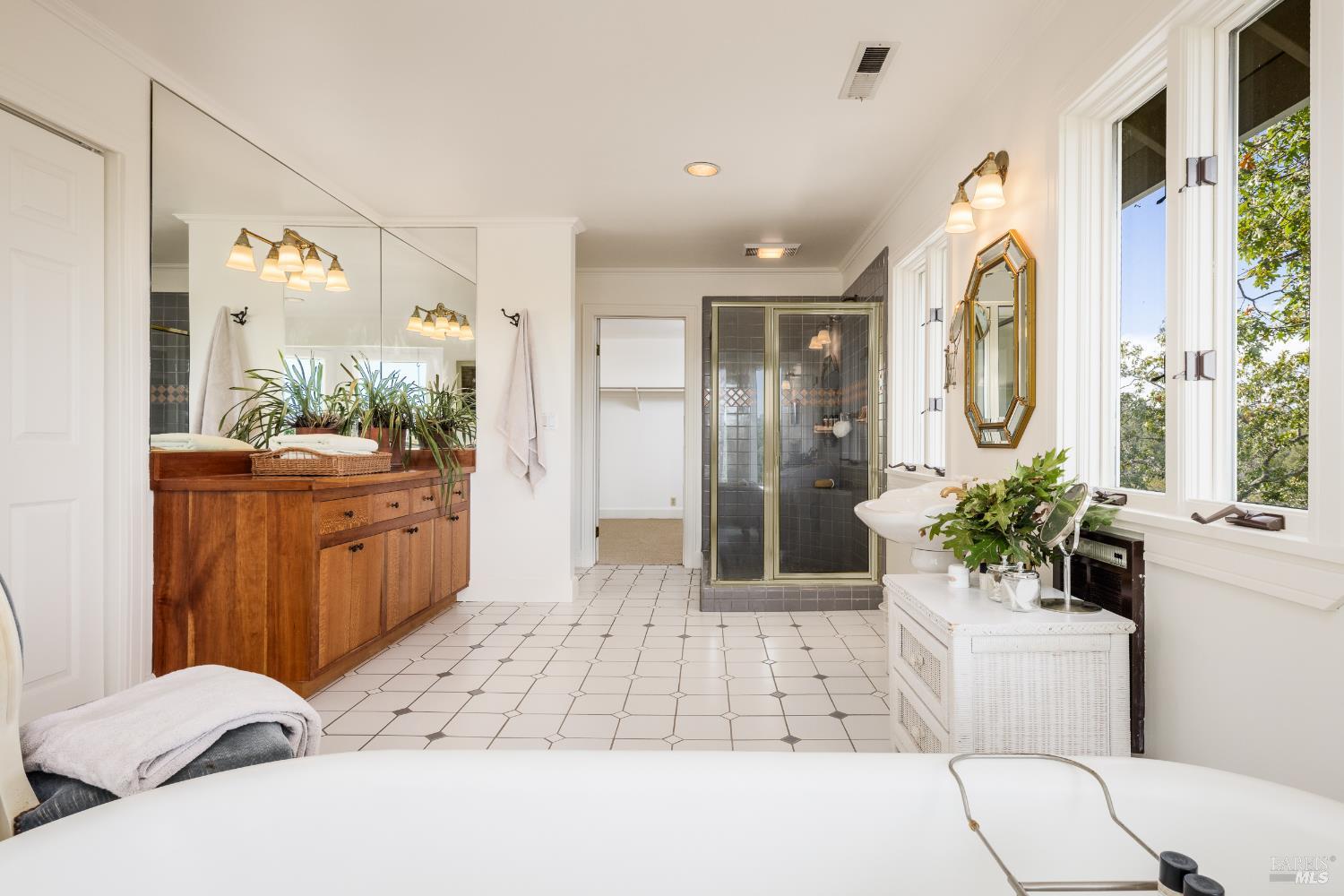 1760 Howell Mountain Road Angwin, CA 94508 - Photo 29 of 31 a spacious bathroom with a double vanity sink and a mirror