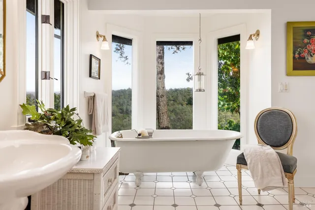 a living room with a large window and a table