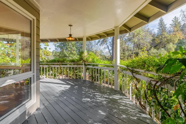 a view of a balcony with wooden floor