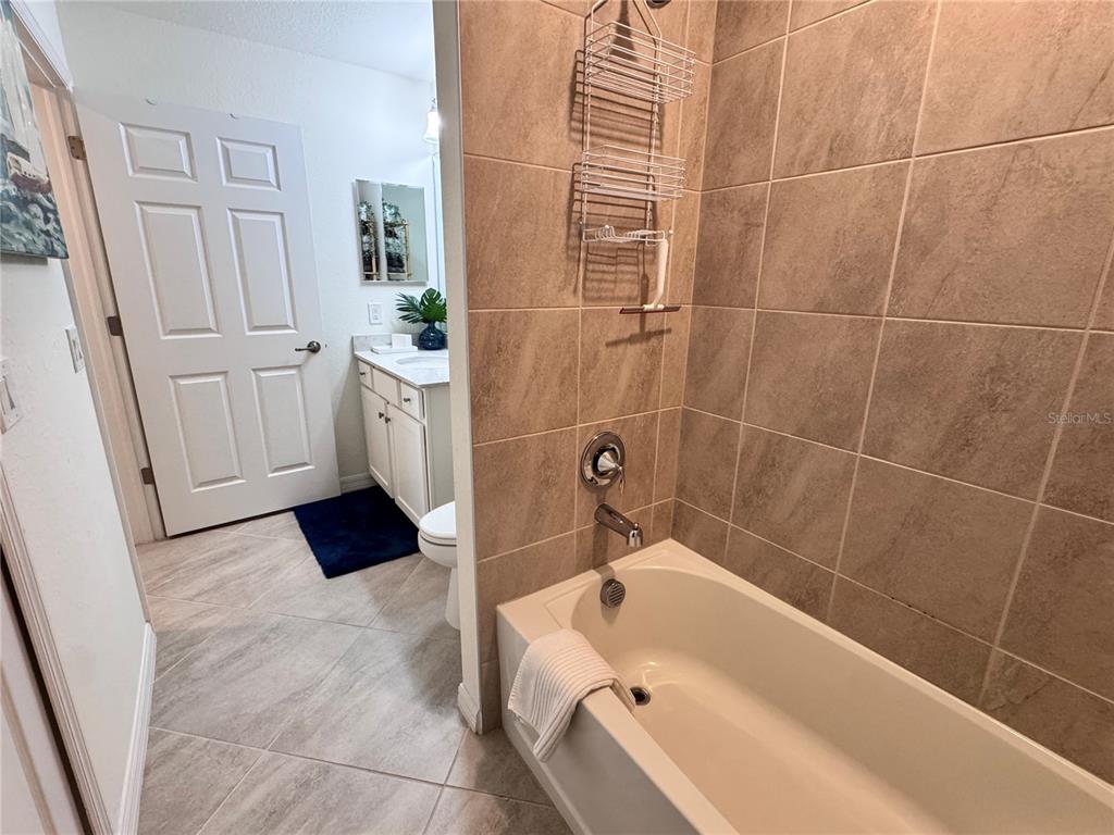 17724 Gawthrop Drive, Unit 304 Bradenton, FL 34211 - Photo 12 of 38 a bathroom with a bathtub and a shower