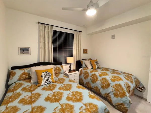 a bedroom with double bed and a window