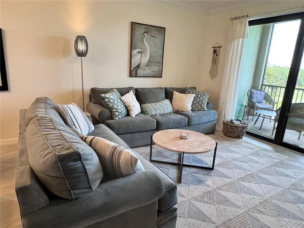 a living room with furniture and a window