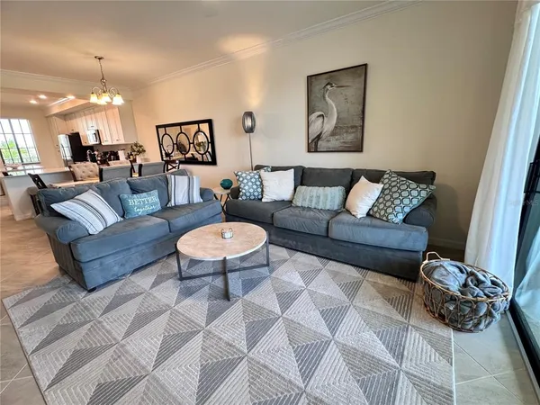 a living room with furniture and a table