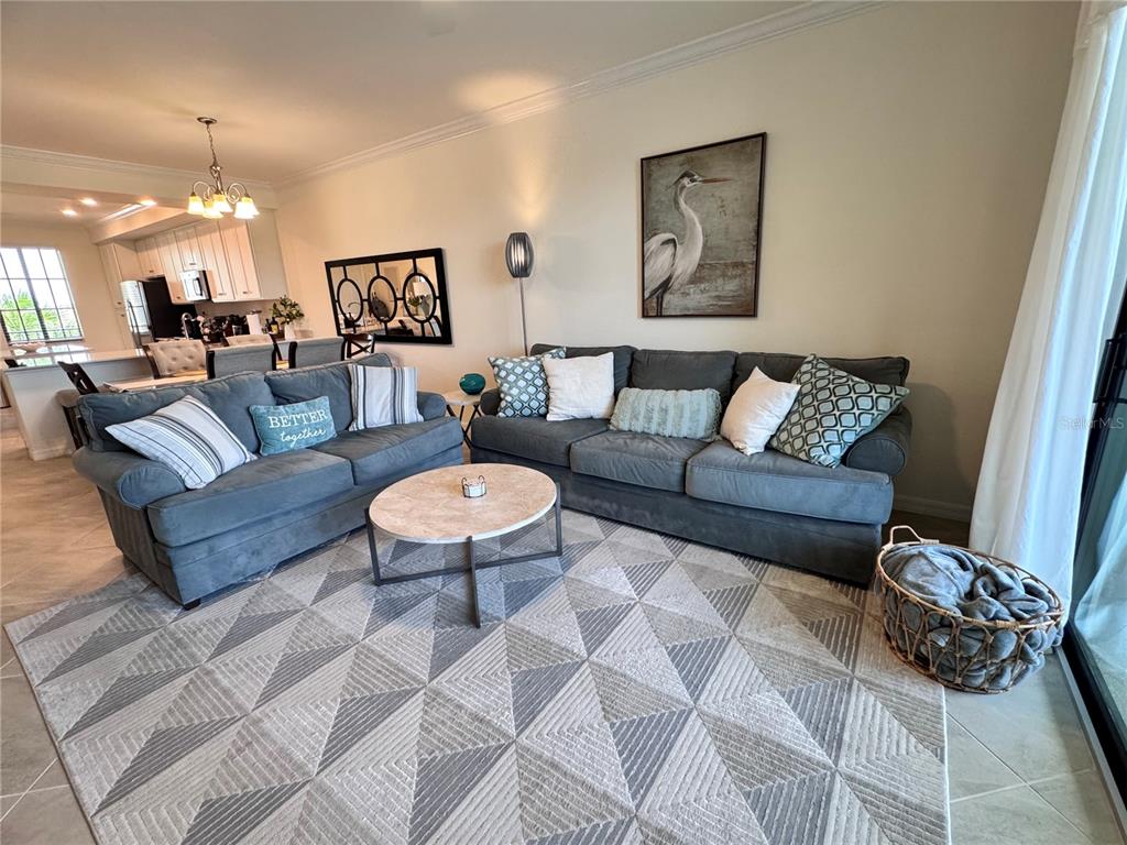 17724 Gawthrop Drive, Unit 304 Bradenton, FL 34211 - Photo 23 of 38 a living room with furniture and a table