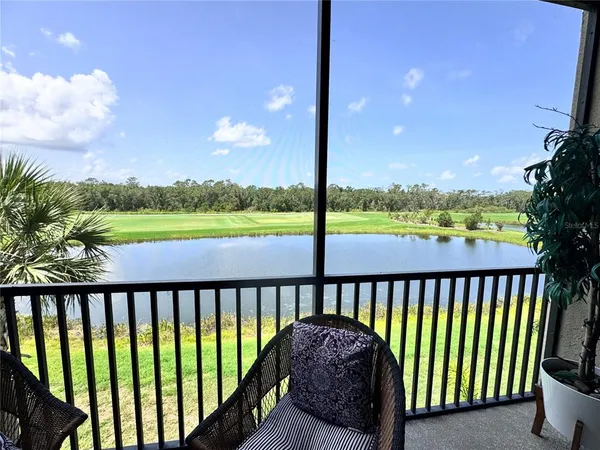 a view of a balcony with lake and mountain view