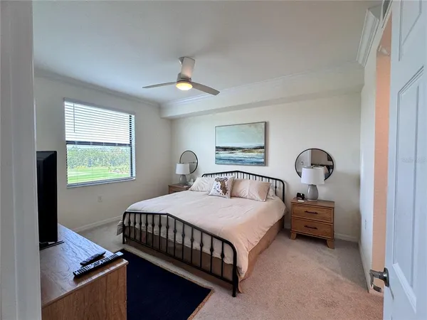 a bedroom with a bed and window