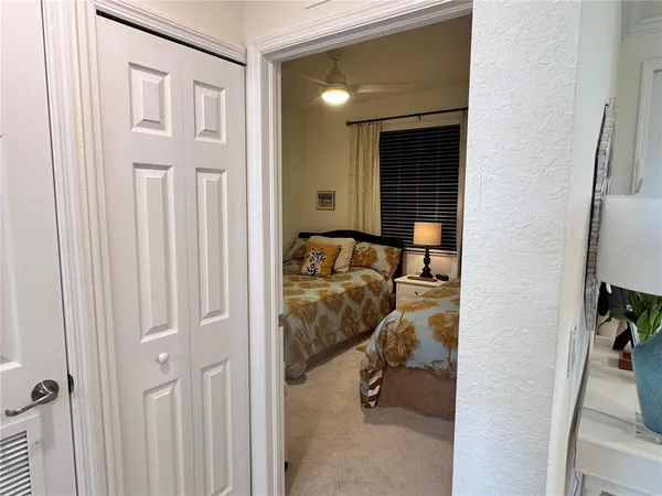 a bedroom with a bed and a mirror