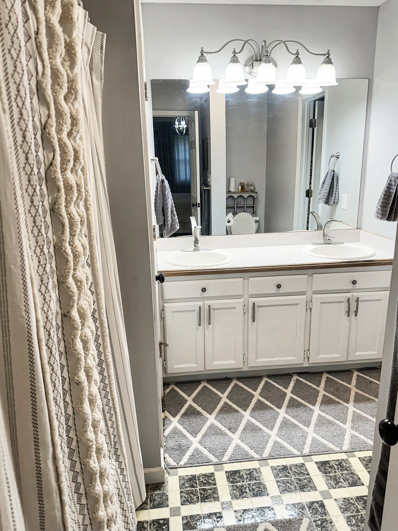 1016 Keyway Drive Pleasant View, TN 37146 - Photo 22 of 30 a bathroom with a double vanity sink and a mirror