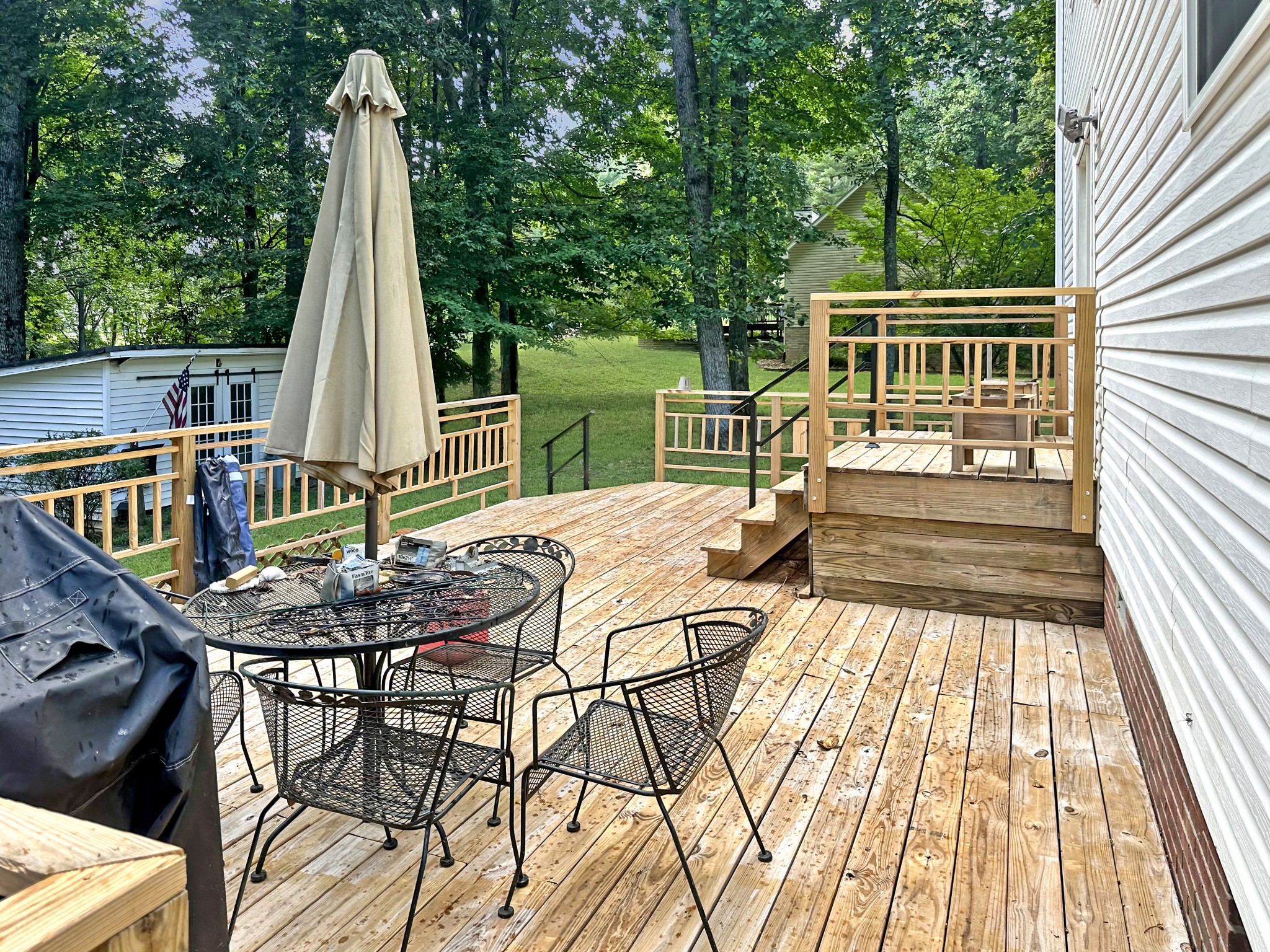 1016 Keyway Drive Pleasant View, TN 37146 - Photo 29 of 30 a view of a patio with a table chairs and wooden floor