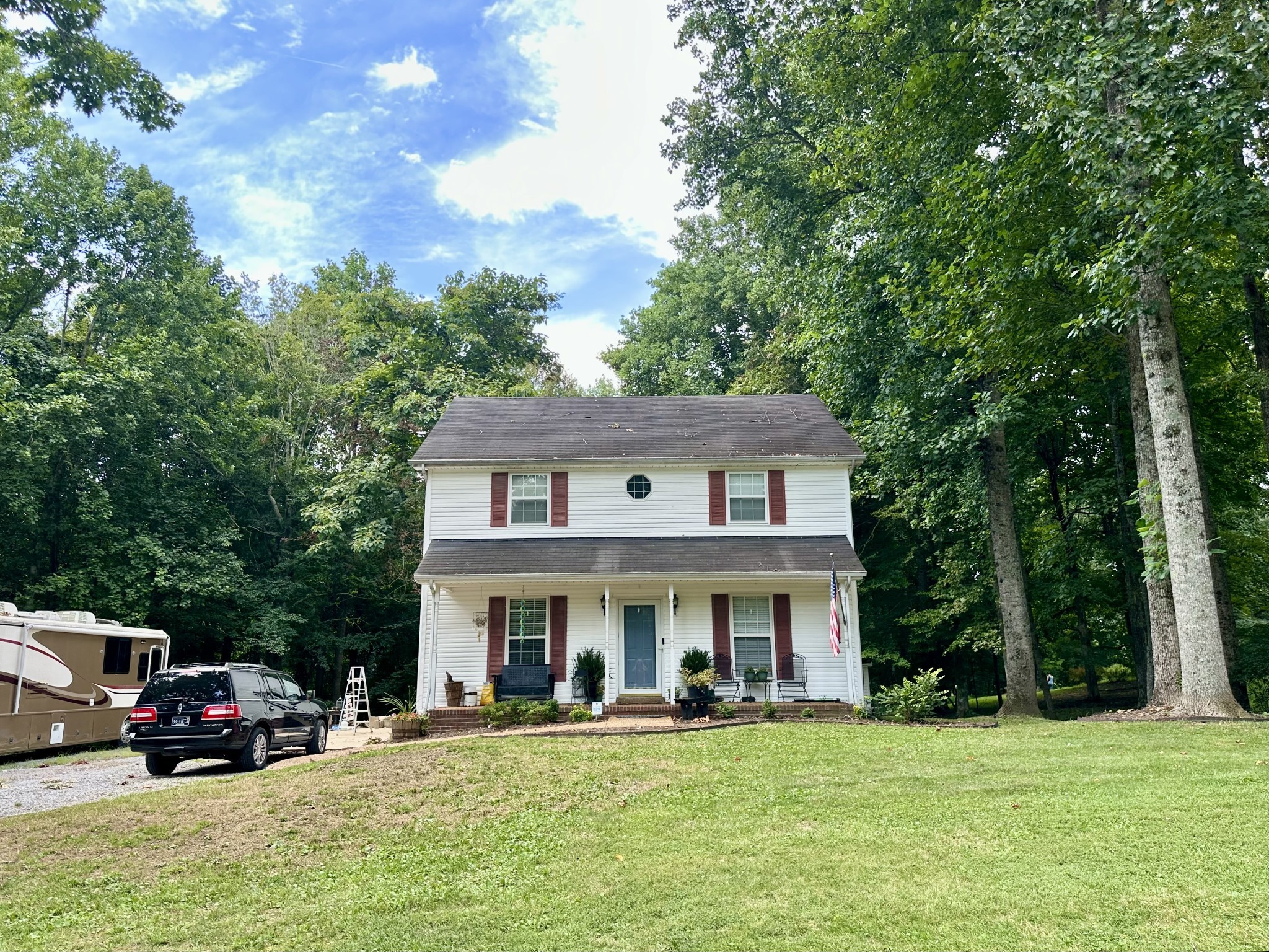 1016 Keyway Drive Pleasant View, TN 37146 - Photo 4 of 30 a view of a big house with a big yard and large trees