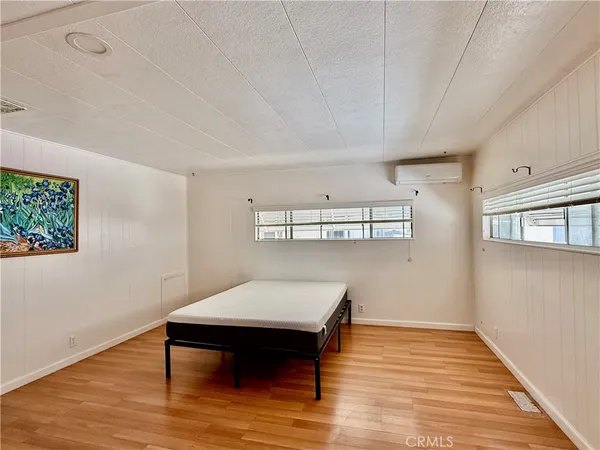 a view of a livingroom with furniture and wooden floor