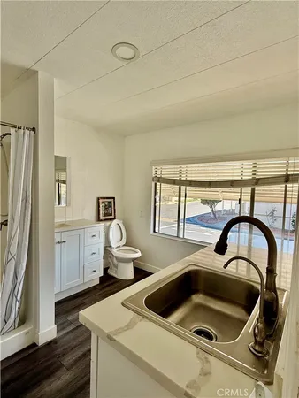 a kitchen with a stove and a sink