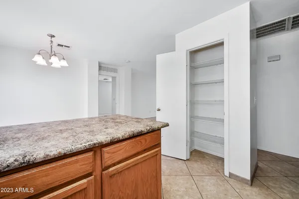 a view hallway with granite countertop cabinets