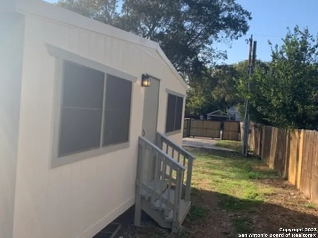 a view of a small yard from a balcony