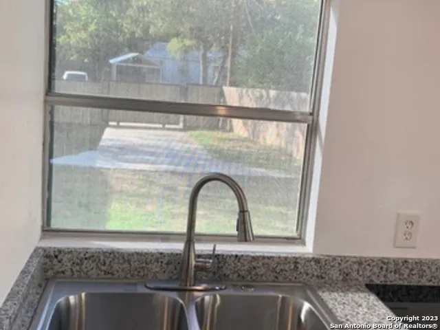 a close view of a sink and a window