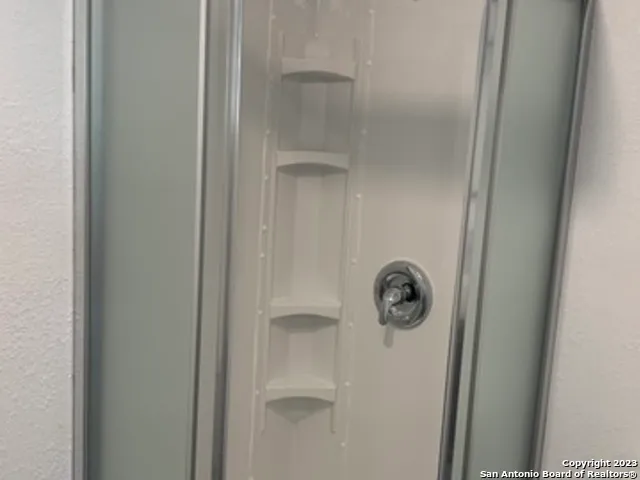 a white door with a shower
