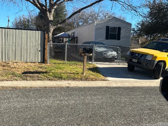 a view of a back yard of the house