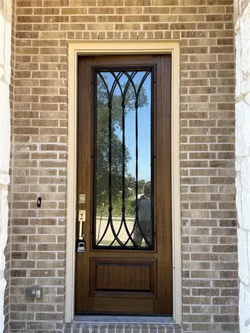 a view of door with wooden floor