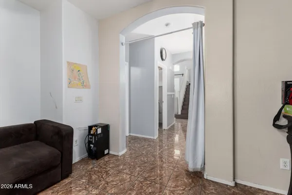 a living room with furniture and a gate