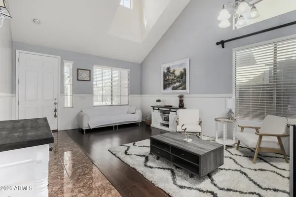 a living room with furniture and a window