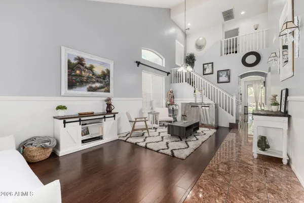 a living room with furniture and a clock