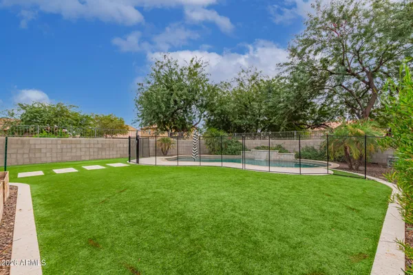 a view of a swimming pool with a outdoor seating