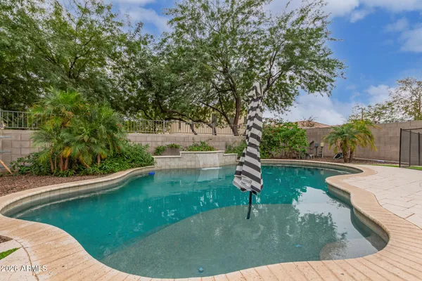a view of a swimming pool with a patio