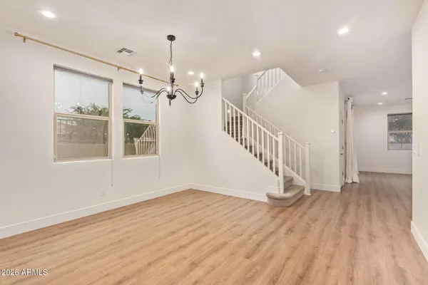 a view of an entryway with wooden floor and door