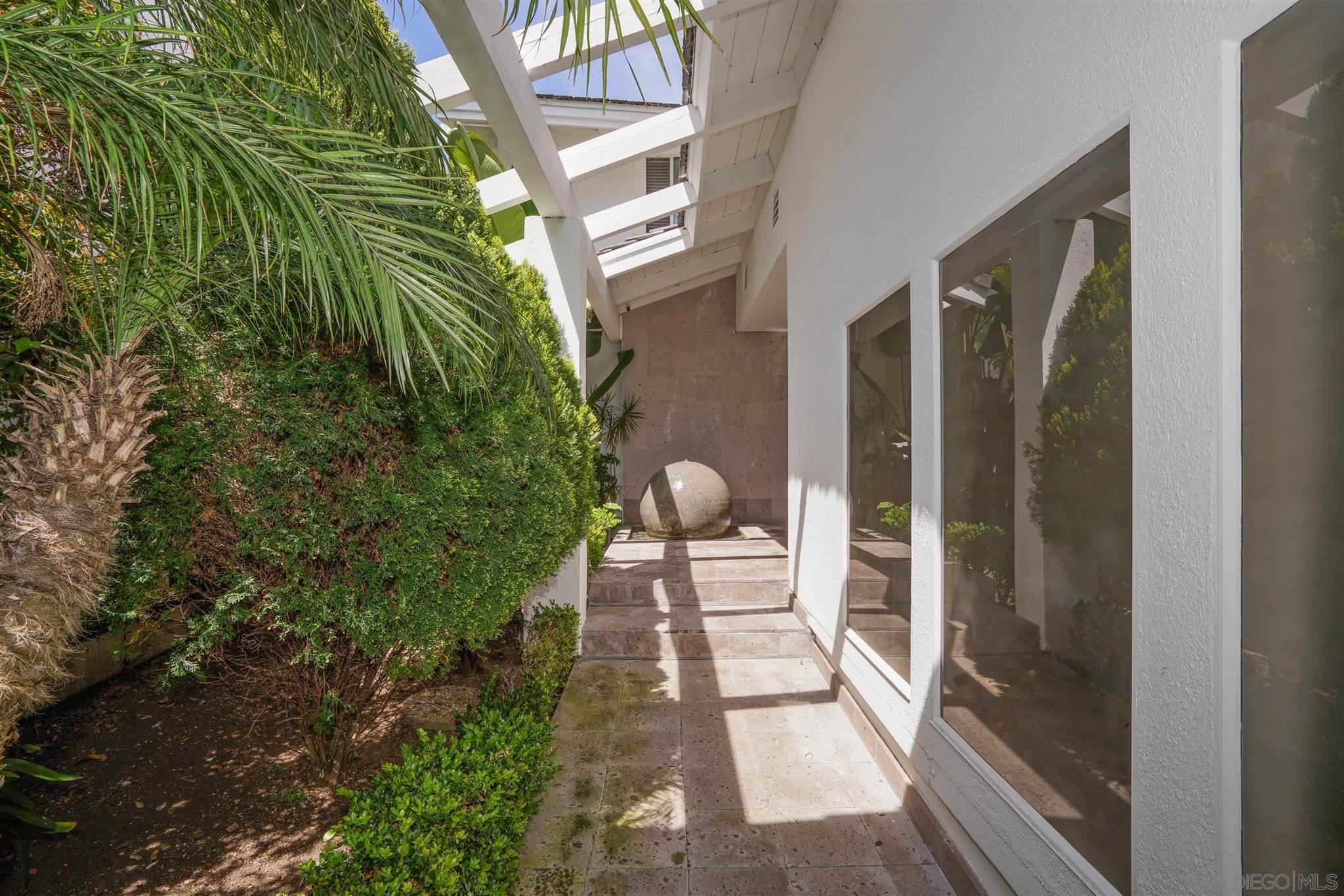 57 Blue Anchor Cay Road Coronado, CA 92118 - Photo 2 of 37 a view of a balcony with chairs and potted plants