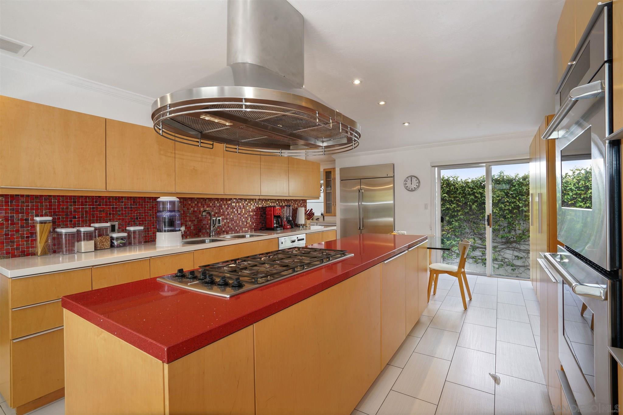 57 Blue Anchor Cay Road Coronado, CA 92118 - Photo 14 of 37 a kitchen with stainless steel appliances granite countertop a stove and a sink