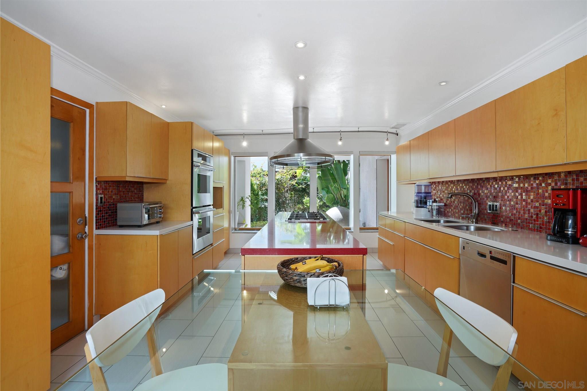 57 Blue Anchor Cay Road Coronado, CA 92118 - Photo 15 of 37 a kitchen with stainless steel appliances a large window in it