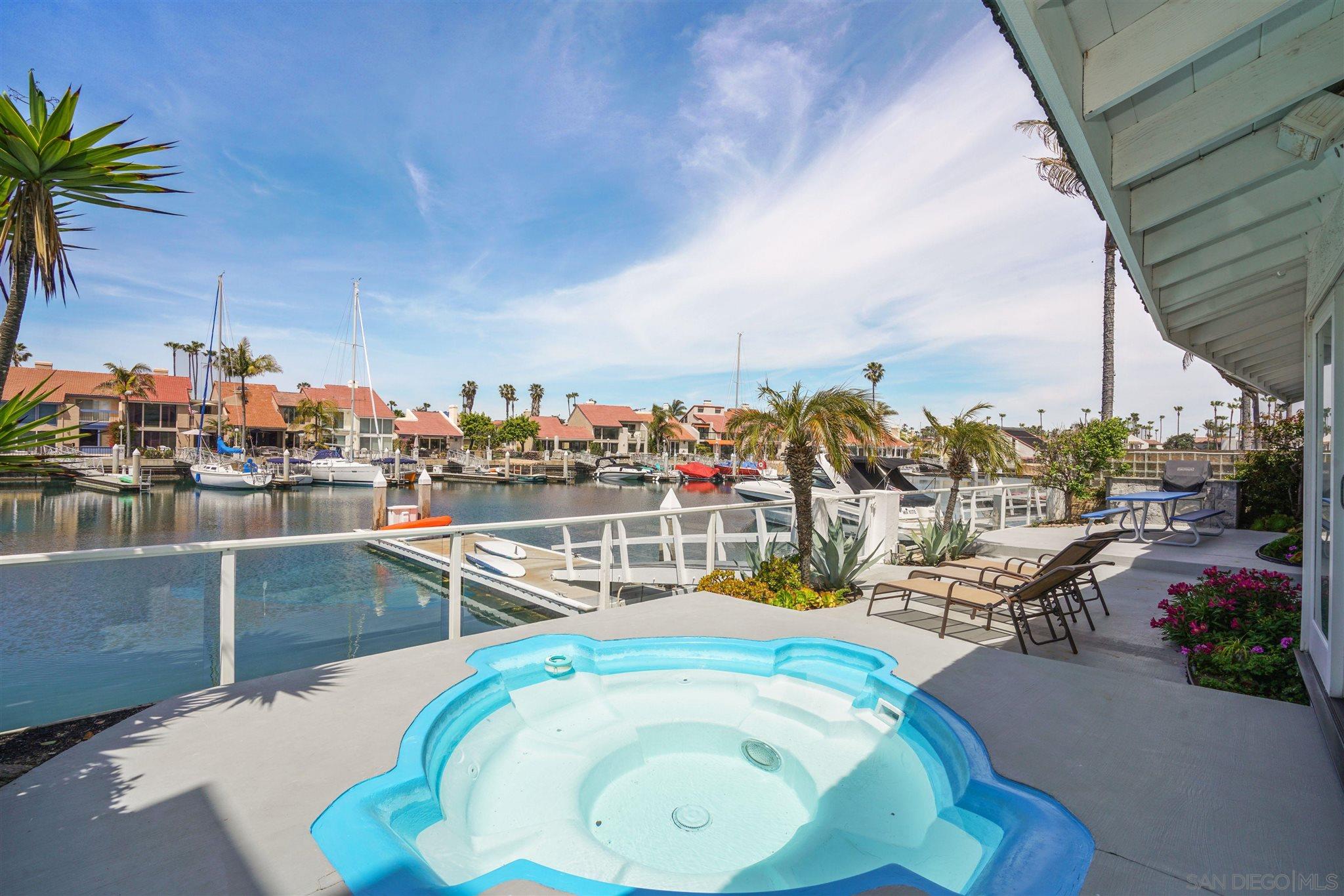 57 Blue Anchor Cay Road Coronado, CA 92118 - Photo 3 of 37 a view of a swimming pool with outdoor seating